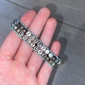 Distressed juicy couture bracelet.